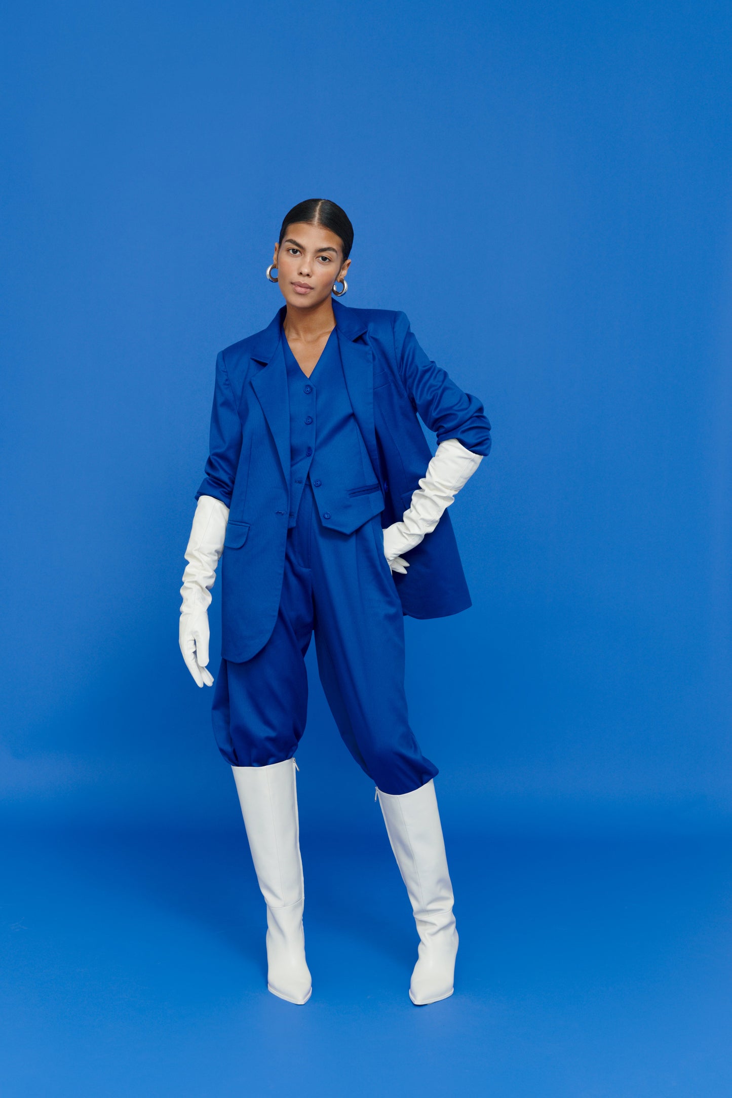 Model wearing Electric Blazer with white skirt – modern office chic