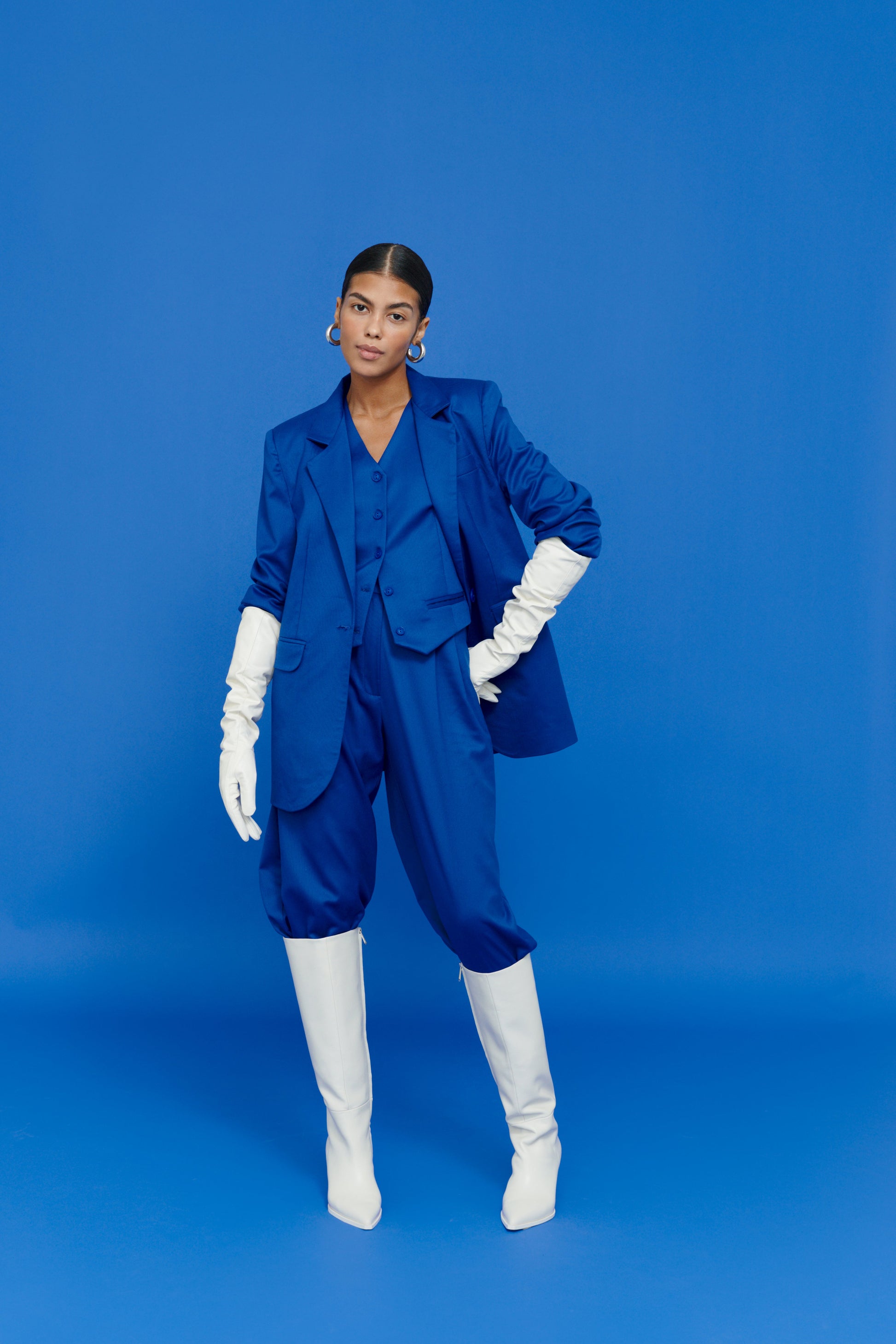 Model wearing Electric Blazer with white skirt – modern office chic