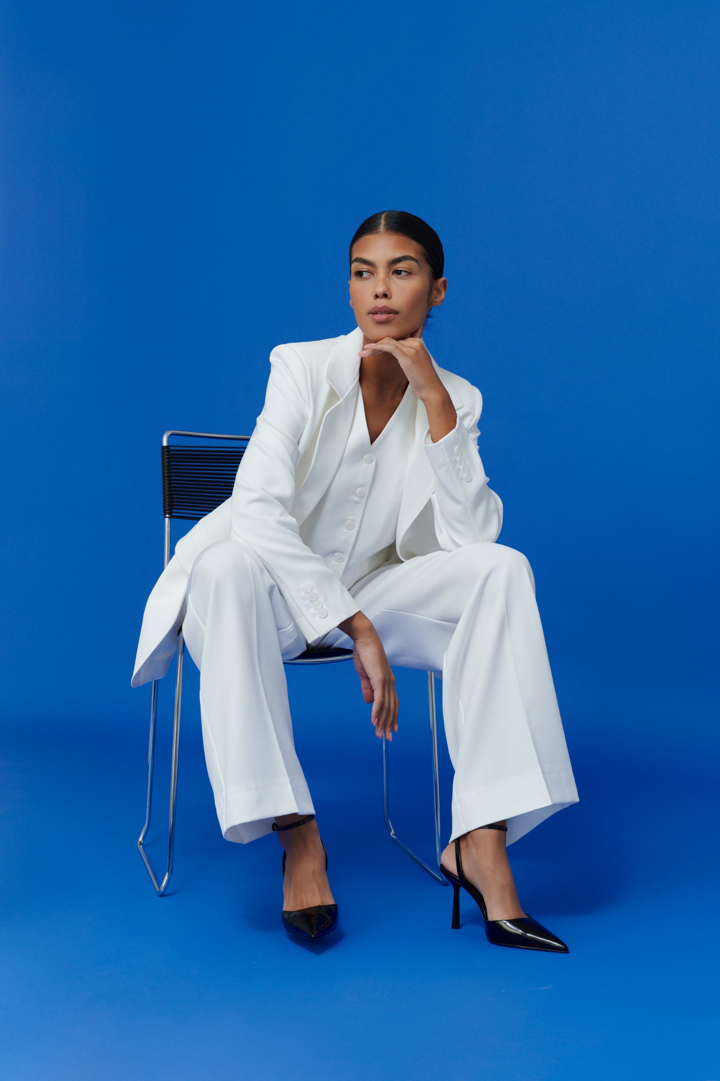 Elegant co-ord white vest styled with matching trousers