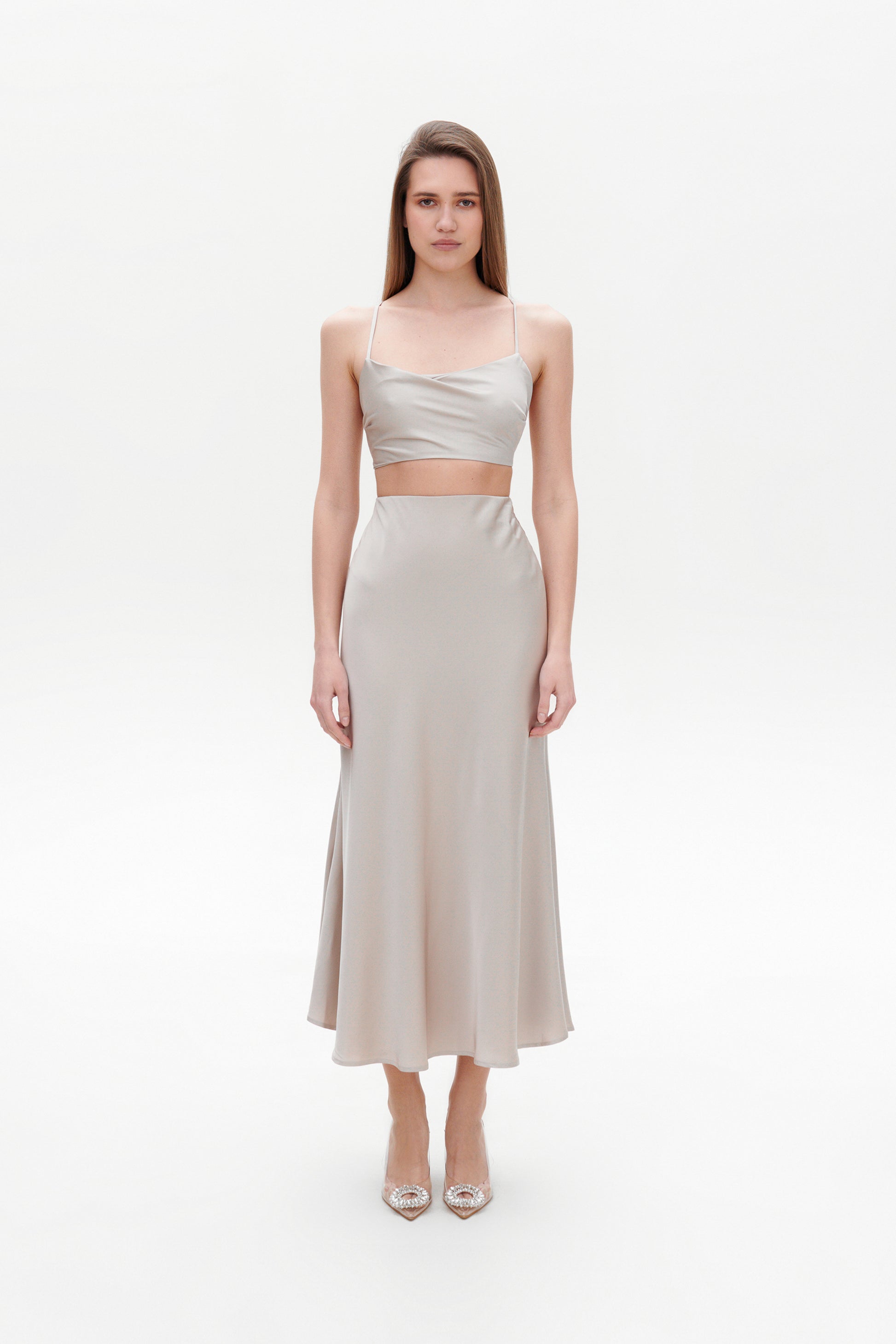 Beige satin skirt front view on model
