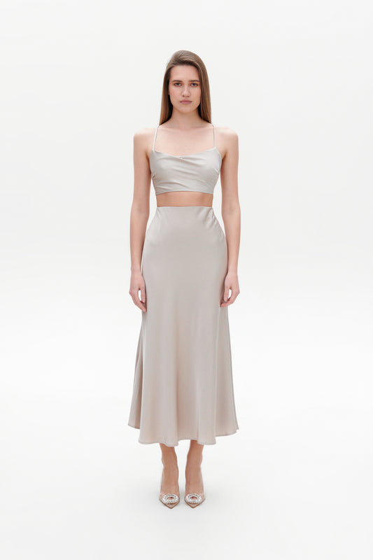 Beige satin skirt front view on model