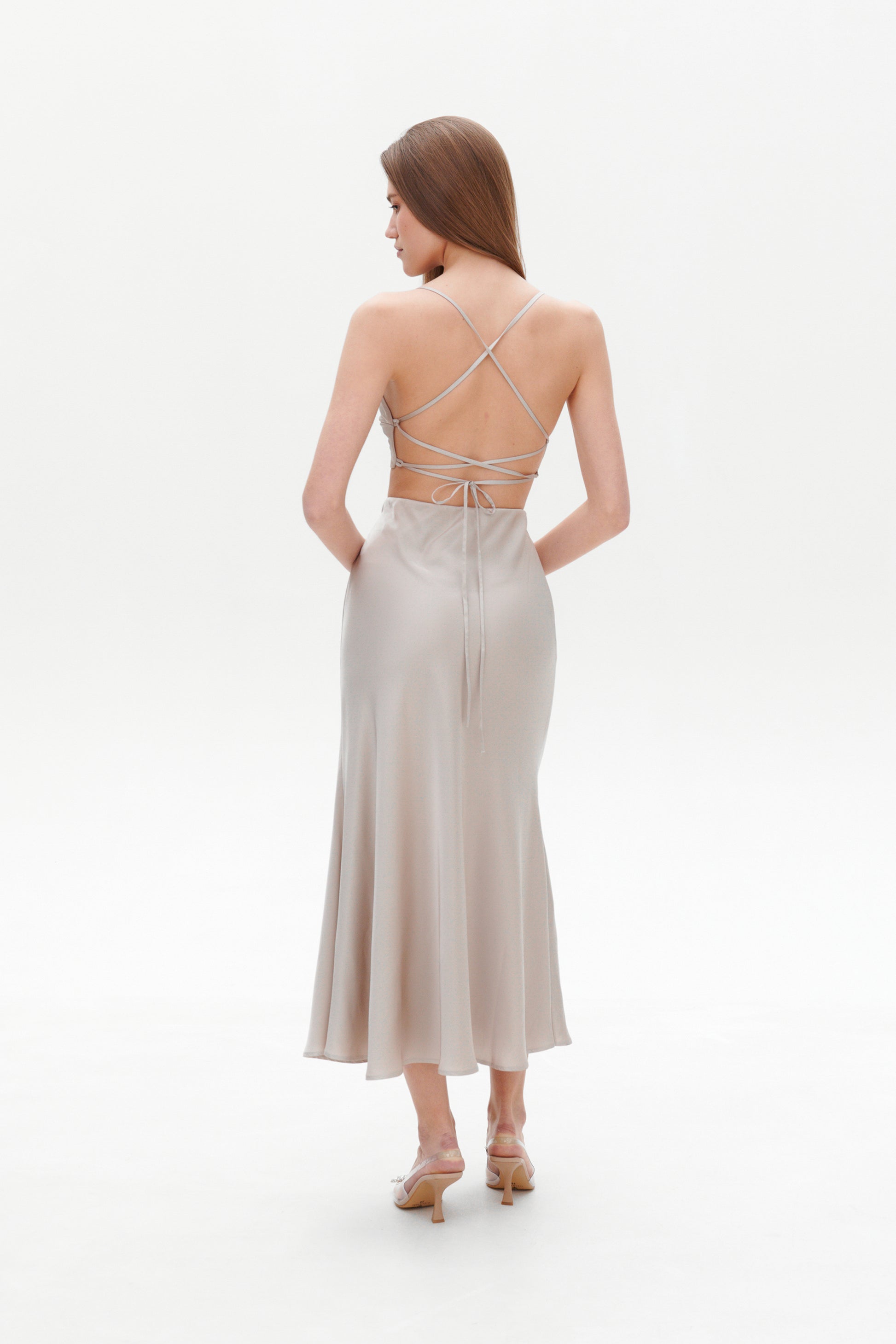 Beige satin skirt back view elegant drape