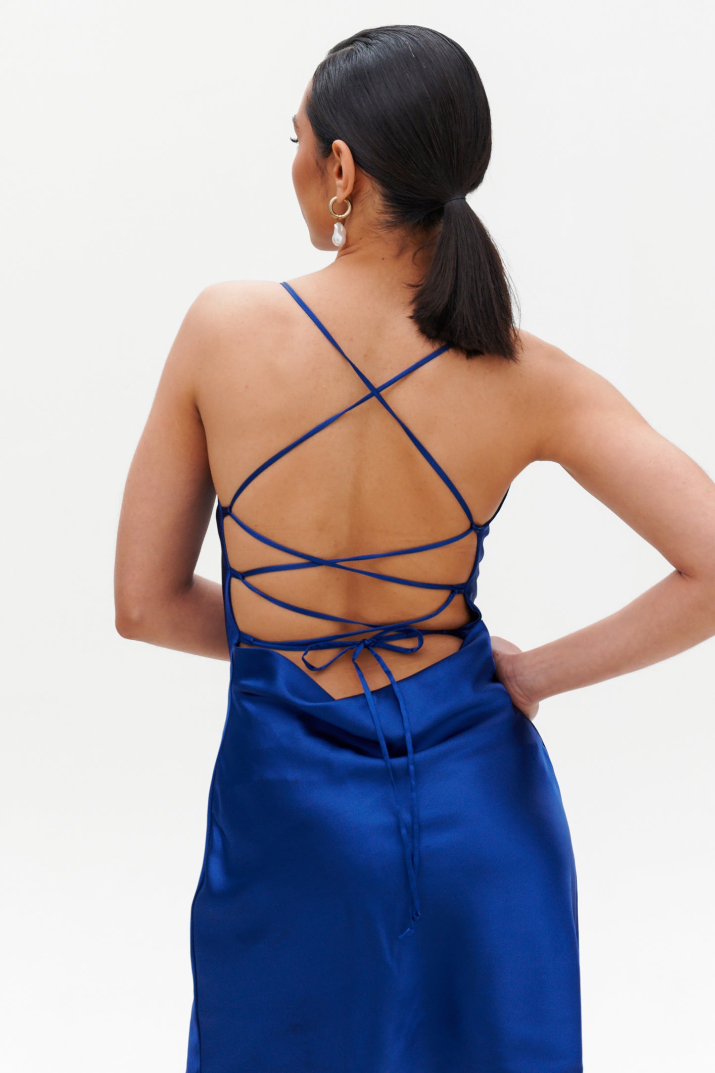 Dark Blue Slip Midi Dress back view – lace-up open back satin dress