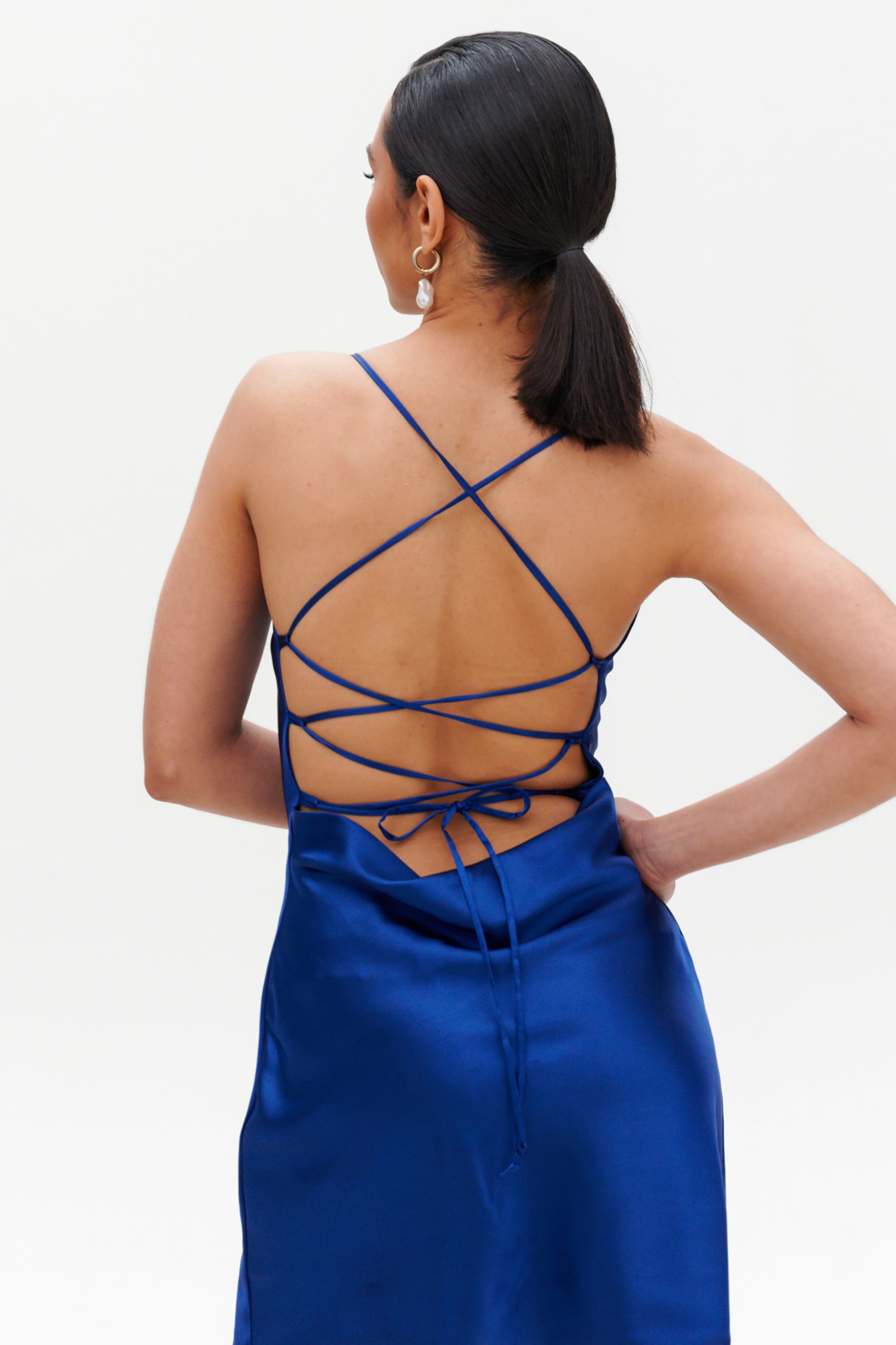 Dark Blue Slip Midi Dress back view – lace-up open back satin dress
