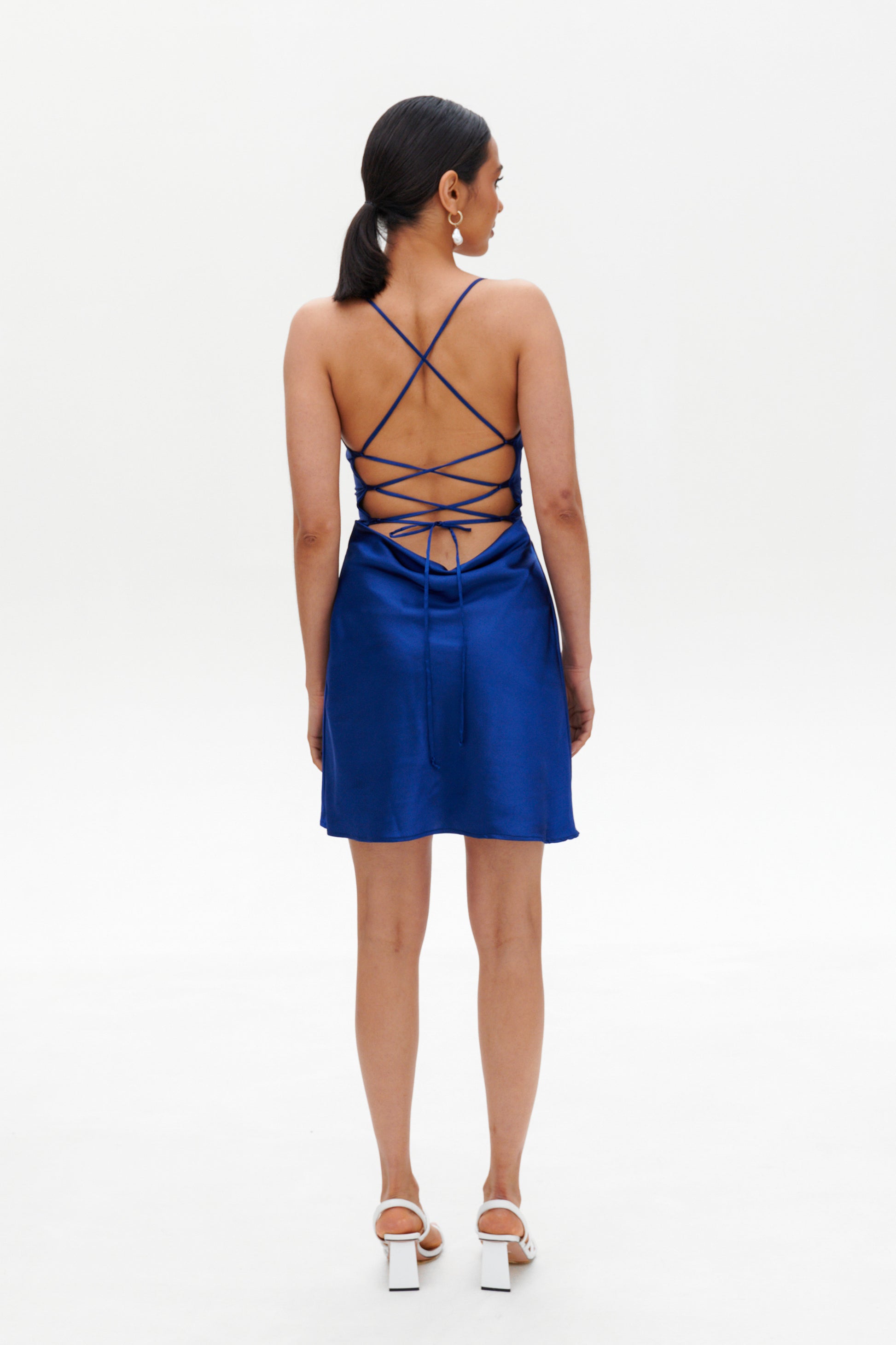 Dark blue slip mini dress model pose – elegant satin outfit