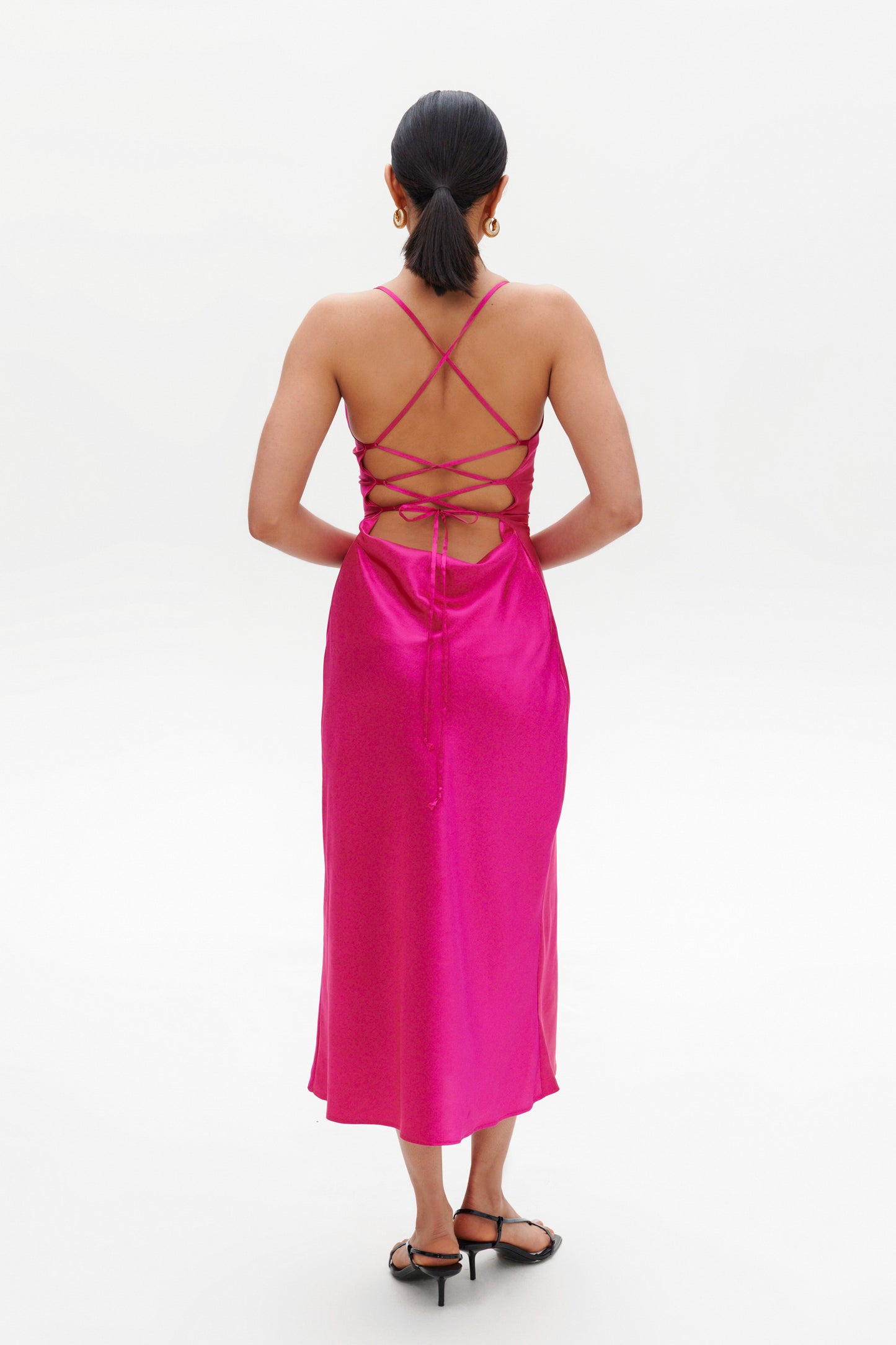 Fuchsia Slip Midi Dress back view – lace-up satin midi style