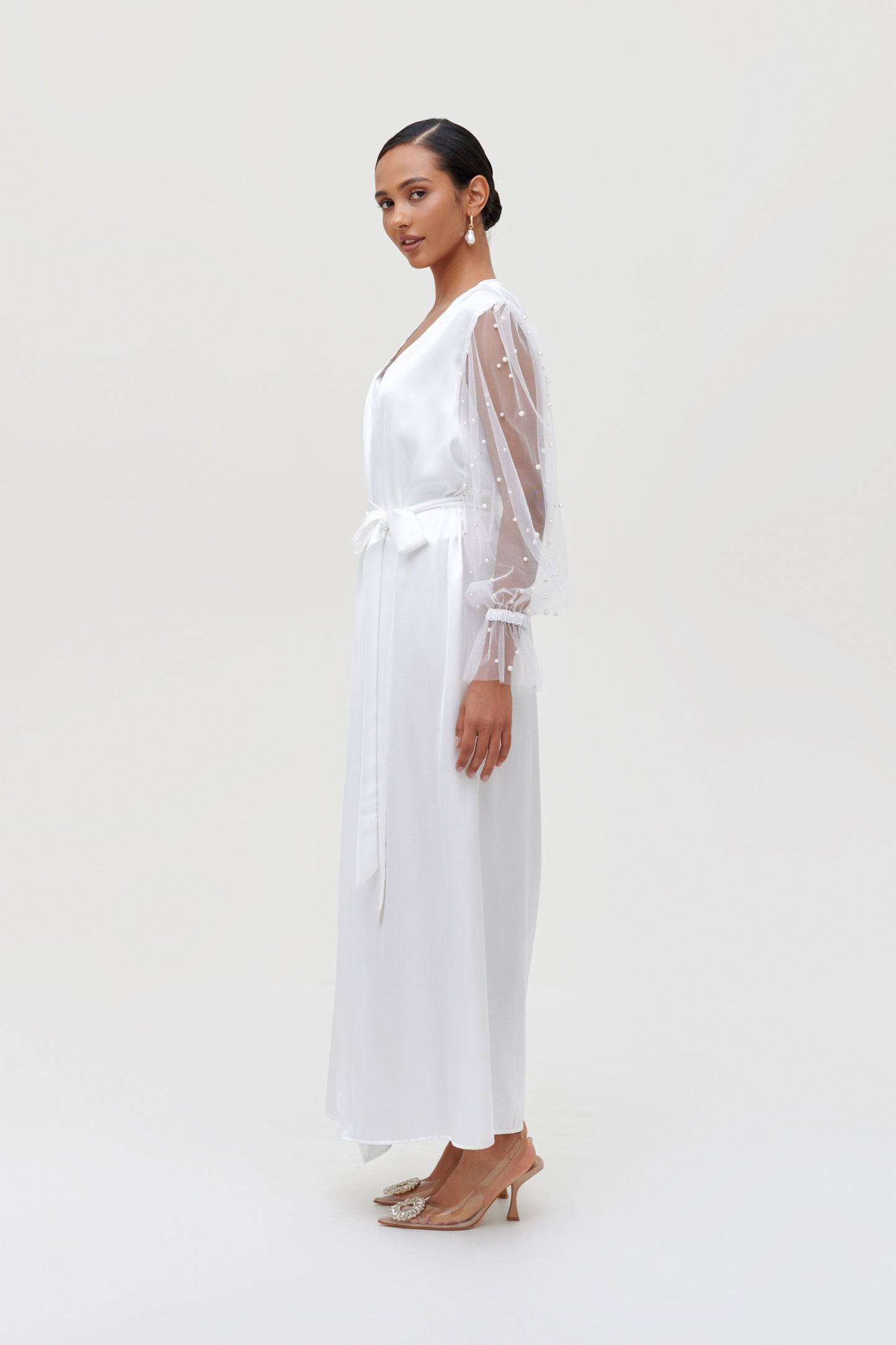 side view of white pearl bridal robe with pearl sleeves
