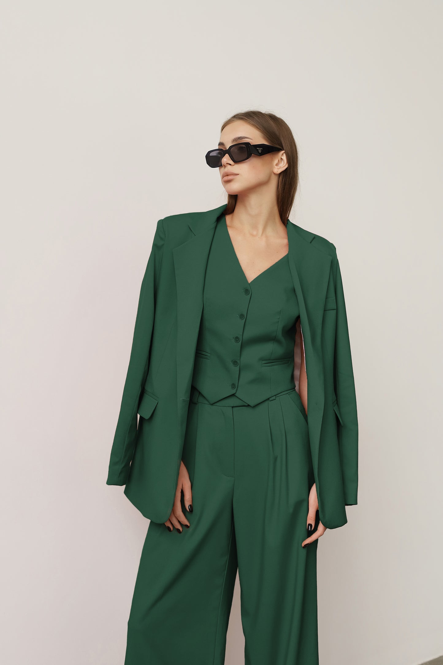 three piece dark green suit